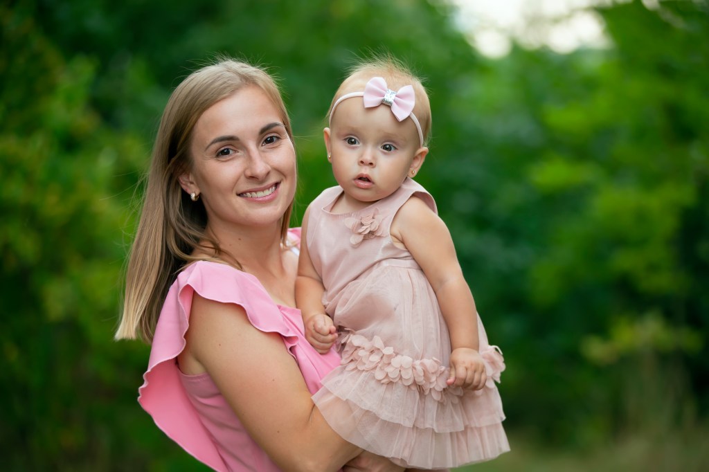 mother holding daughter